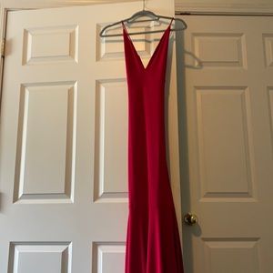 Size S red prom dress. Long flared bottom and criss-cross back.